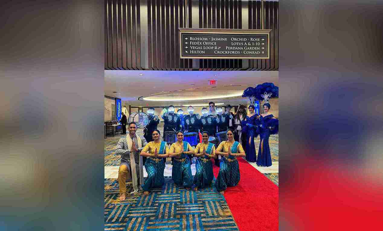 A marching band and a dance group performing at a corporate event in Las Vegas A marching band and a dance group performing at a corporate event in Las Vegas